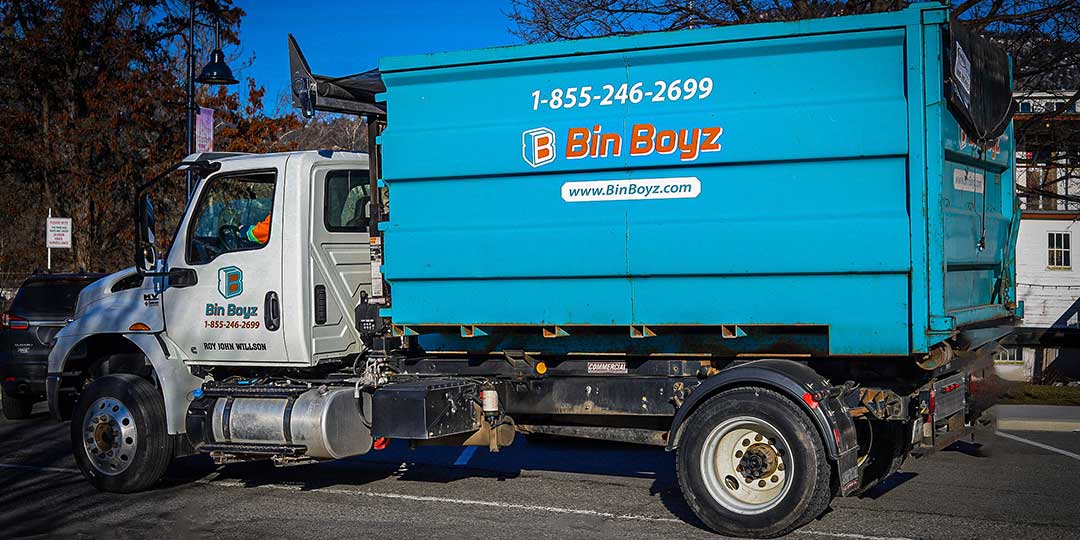 Bin Boyz truck delivering bin residential 2803