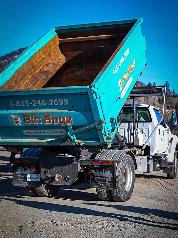 Bin Boyz truck lifting up bin rusty interior